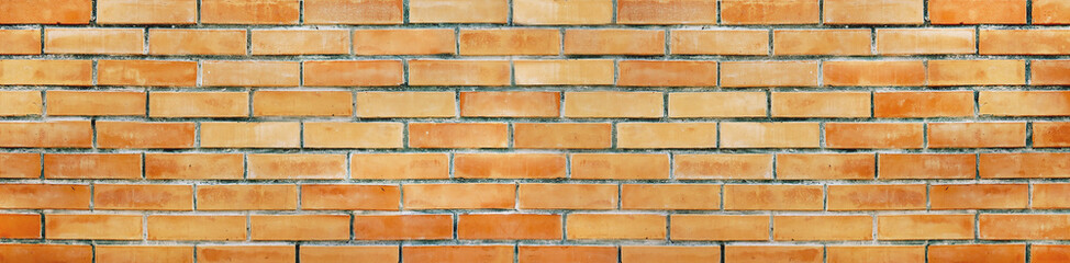 Spotted rough orange brick texture background. Brick wall banner