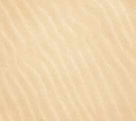Fototapeta na wymiar Wavy beige sand texture background