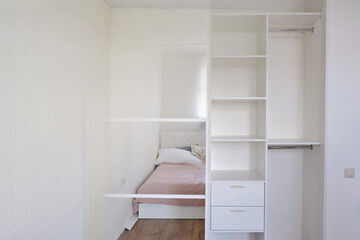 New built-in wardrobe in the bedroom - before and after installation. Modern furniture with mirror and shelves