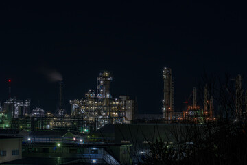 Plakat factory at night