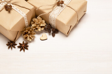 Gold rustic christmas boxes pine cones close up