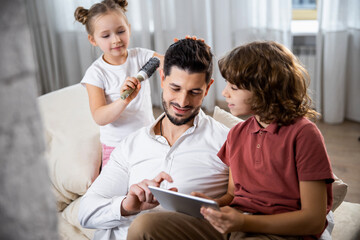 Fototapeta premium Father and son using a tablet
