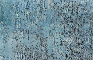 Texture of blue ribby stucco on cement wall.