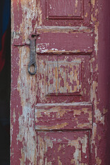 Old wooden door painted red.