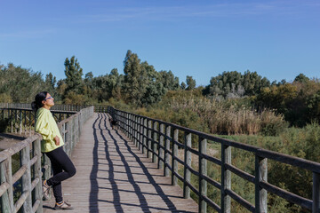 woman on walkway in nature