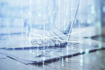 Fototapeta premium Double exposure of laptop computer and technology theme hologram. Concept of freelance work.
