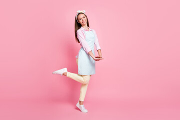 Full size photo of pretty charming girl enjoy home house free time wear good look clothes sneakers isolated over pastel color background