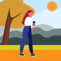 A girl with hot drinks in her hands is walking in an autumn Park