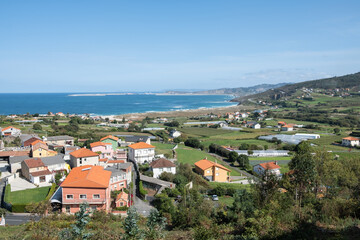 Exterior port os Coruña and Barrañan beach with village on the coast in first term
