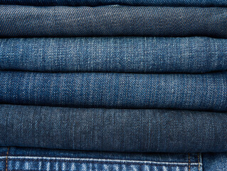 stack of assorted blue jeans