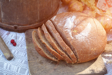 Still life with a chopped hearth black bread.