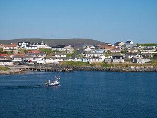 Fototapeta premium The coastal community of Hamnavoe on the west of Mainland, Shetland, Scotland, UK - taken from Fugla Ness on a sunny day in summer