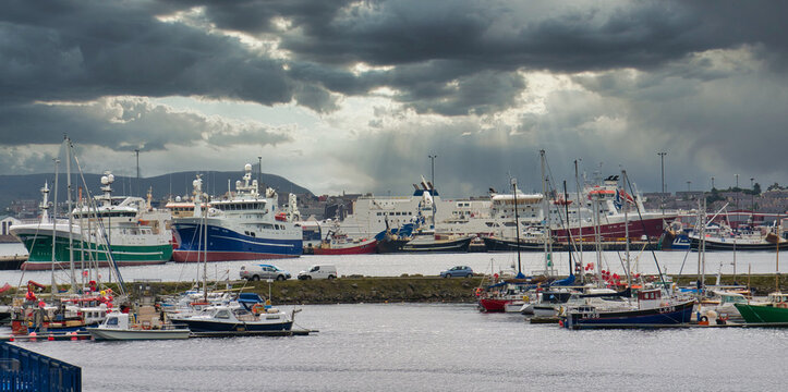 With the marina in the foreground, the boats of the Whalsay pelagic fishing fleet moored behind and the Northlink Ferry at the Holmsgarth Terminal, a view of Lerwick harbour