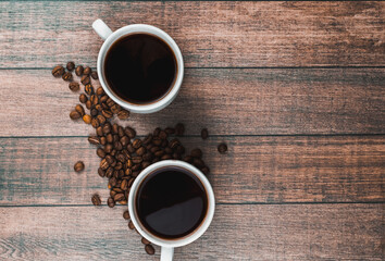 White Cup of hot coffee on a wooden table