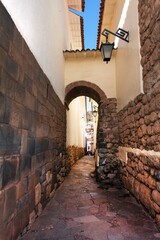 narrow street and buildings wall in centre of Cusco