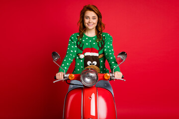 Photo portrait of scooter rider isolated on vivid red colored background