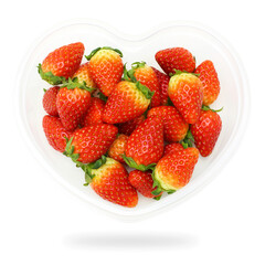 Strawberries in a bowl shaped heart with isolated on white background