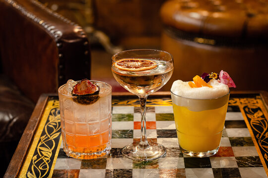 Fancy drinks set up on checkerboard in a antique vip room side view