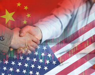 Businessmen shaking hands as a sign of China's cooperation with America. Financial  and business cooperation concept.