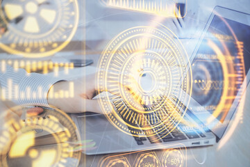 Technology theme hologram with man working on computer on background. High tech concept. Double exposure.