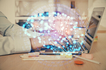 Man typing on keyboard background with brain hologram. Concept of big Data. Double exposure.