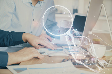 Fototapeta premium Start up drawings with businessman working on computer on background. Teamwork concept. Double exposure.