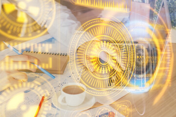 Technology theme hologram with man working on computer on background. High tech concept. Multi exposure.