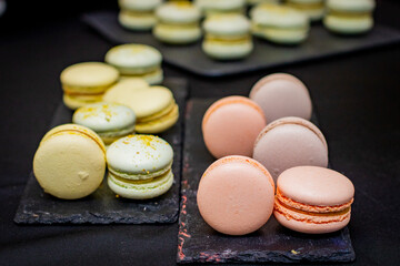 Macarons of different colors on the board