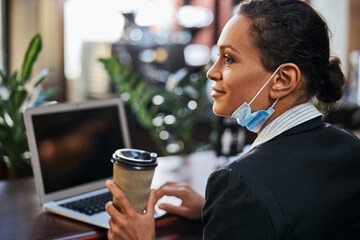 Portrait of cute brunette female working with pleasure