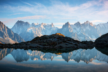 Incredible view of clear water and sky reflection on Chesery lake (Lac De Cheserys) in France Alps....