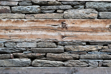 Mixed abstract background texture of wood and masonry wall.
