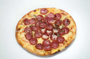 Pepperoni pizza on white background. Copy space. Selective focus