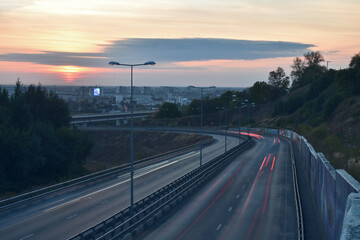cars move in Nizhny Novgorod at sunset