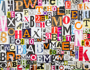 Colorful abstract collage from clippings with letters and numbers texture background. Torn and...