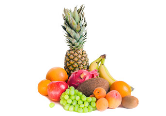 Assortment of various fruits isolated pineapple, bananas, pitaya, green grapes, apple, coconut, peaches, apricots, tangerines and kiwi