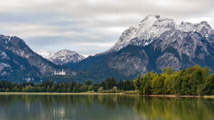 Fototapeta na wymiar Amazing views from the Forggensee lake in Germany with view of neuschwanstein castle 