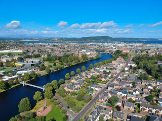 Aerial view of Inverness city, showing the beauty of the River Ness with its famous bridges and landmarks the cathedral and castle in the background