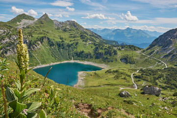 Panoramic mountain landscape with mountain lake in austria. Beautiful mountain lake in the austrian alps.