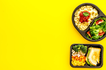 Overhead view of food delivery lunch boxes with meal