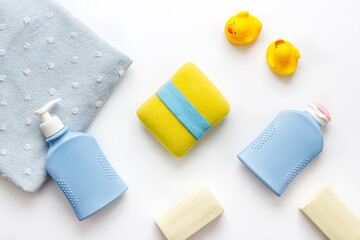 Baby cosmetic items with ducks rubber toy, from above