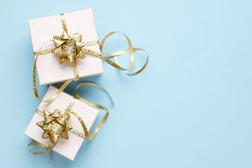 Gifts boxes on pastel blue background. Christmas festive layout