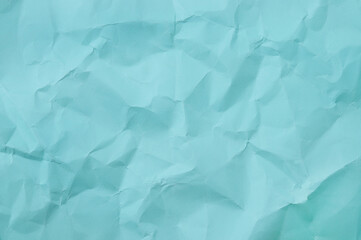 Obraz premium Blue background of crumpled paper.