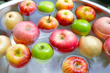 Washing fresh apples in the water
