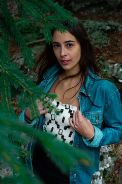 young girl among the branches of a tree