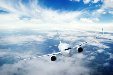 Fototapeta na wymiar Airplane in the sky. Passenger Airliner in clouds.