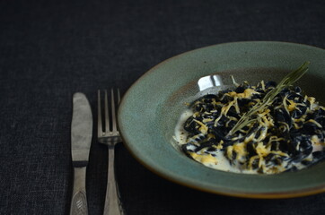 
Italian pasta with cuttlefish ink close up on dark background