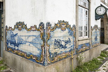 azulejos panels representing scenes from the countryside on the walls of the Sao Mamede de Infesta train station near Porto, Portugal