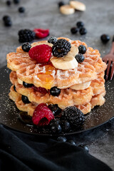 waffles with honey, blueberries, raspberries and banana