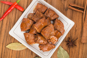 Delicious spiced duck neck on a plate