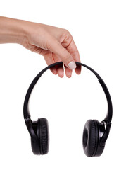 Hand with Wireless black headphones. Isolated on white background.